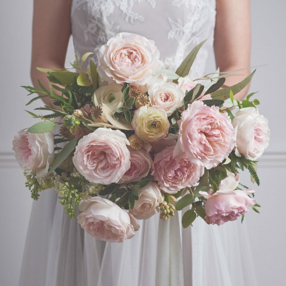 David Austin Keira garden roses in a soft pink and ivory wedding bouquet
