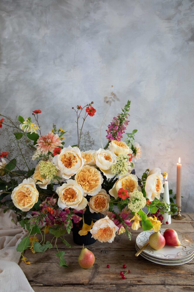 David Austin Effie, gold garden roses in a large floral arrangement